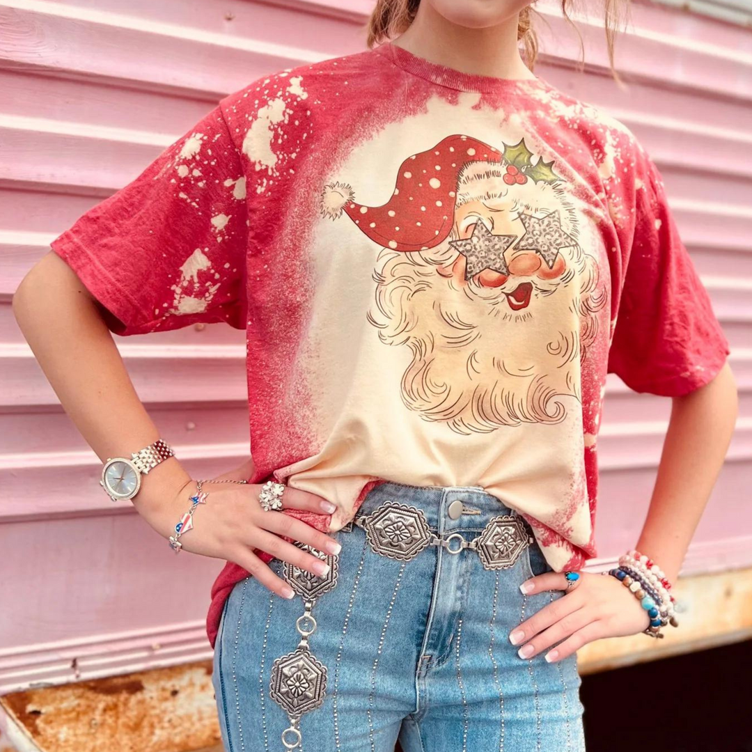Online Exclusive | Santa with Star Eyes Christmas Graphic Tee in Red Bleached - Giddy Up Glamour Boutique