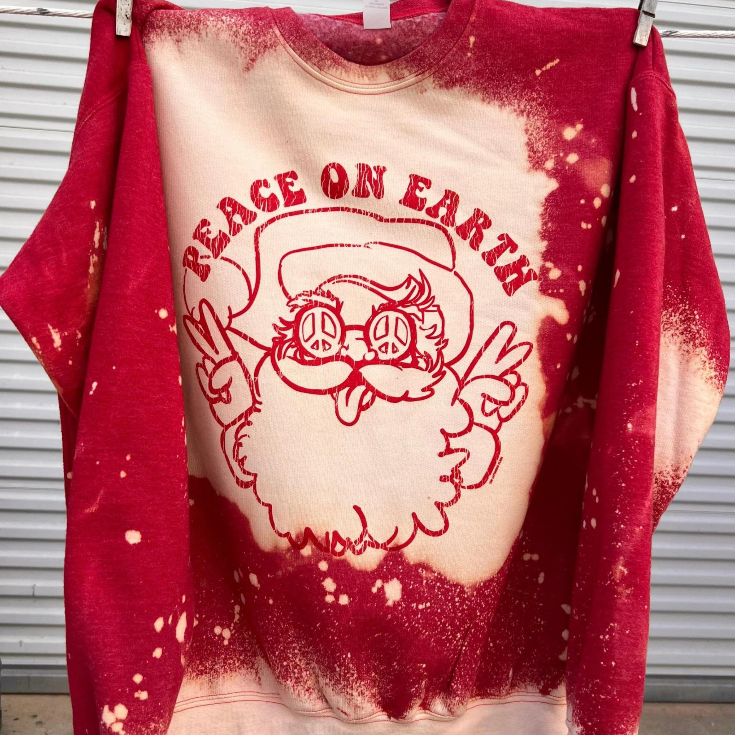Online Exclusive | Peace on Earth Santa Christmas Graphic Sweatshirt in Red Bleach - Giddy Up Glamour Boutique