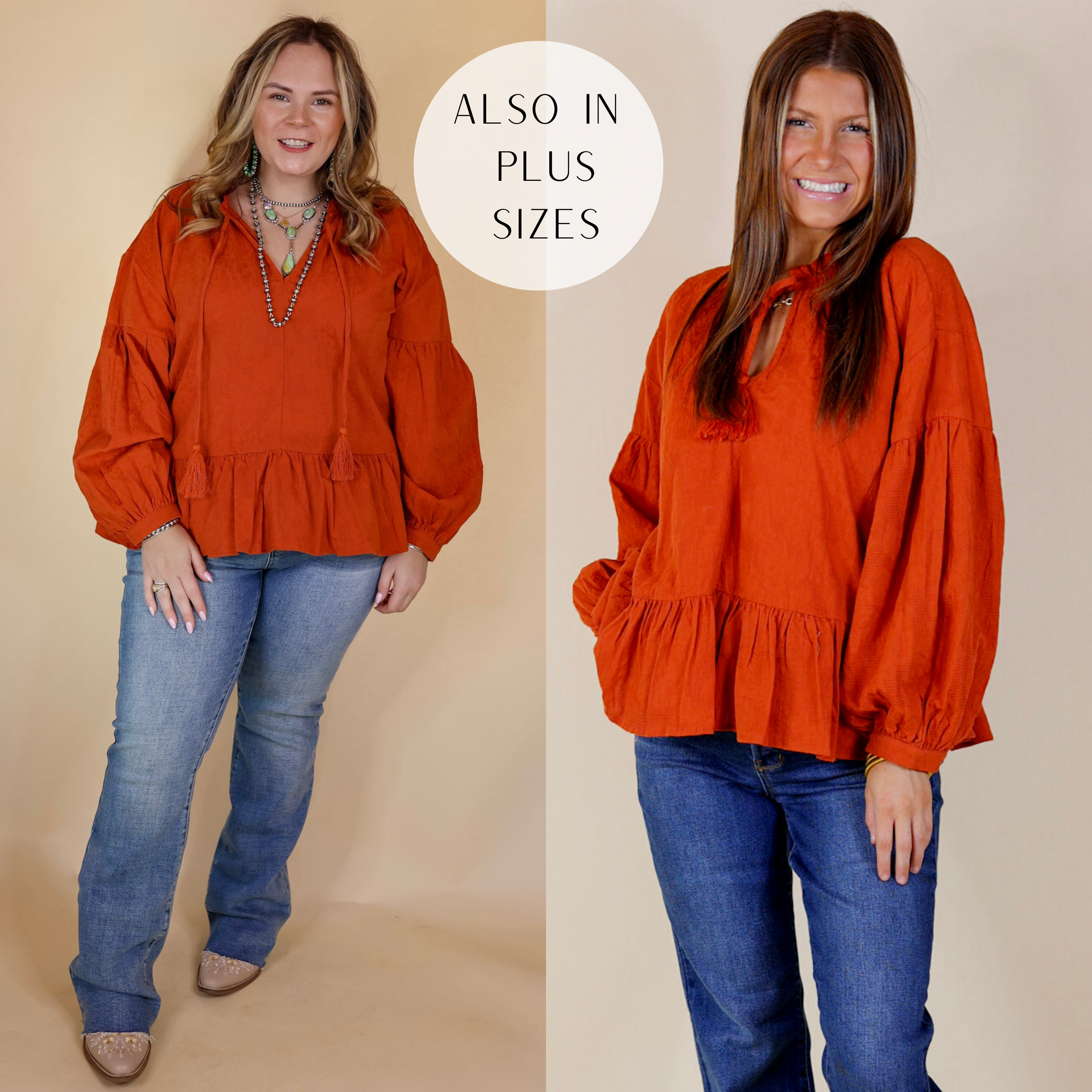 Model is wearing a textured long sleeve peplum top with a front keyhole in orange. Model has this top paired with jeans, booties, and Navajo jewelry. Background is solid tan.