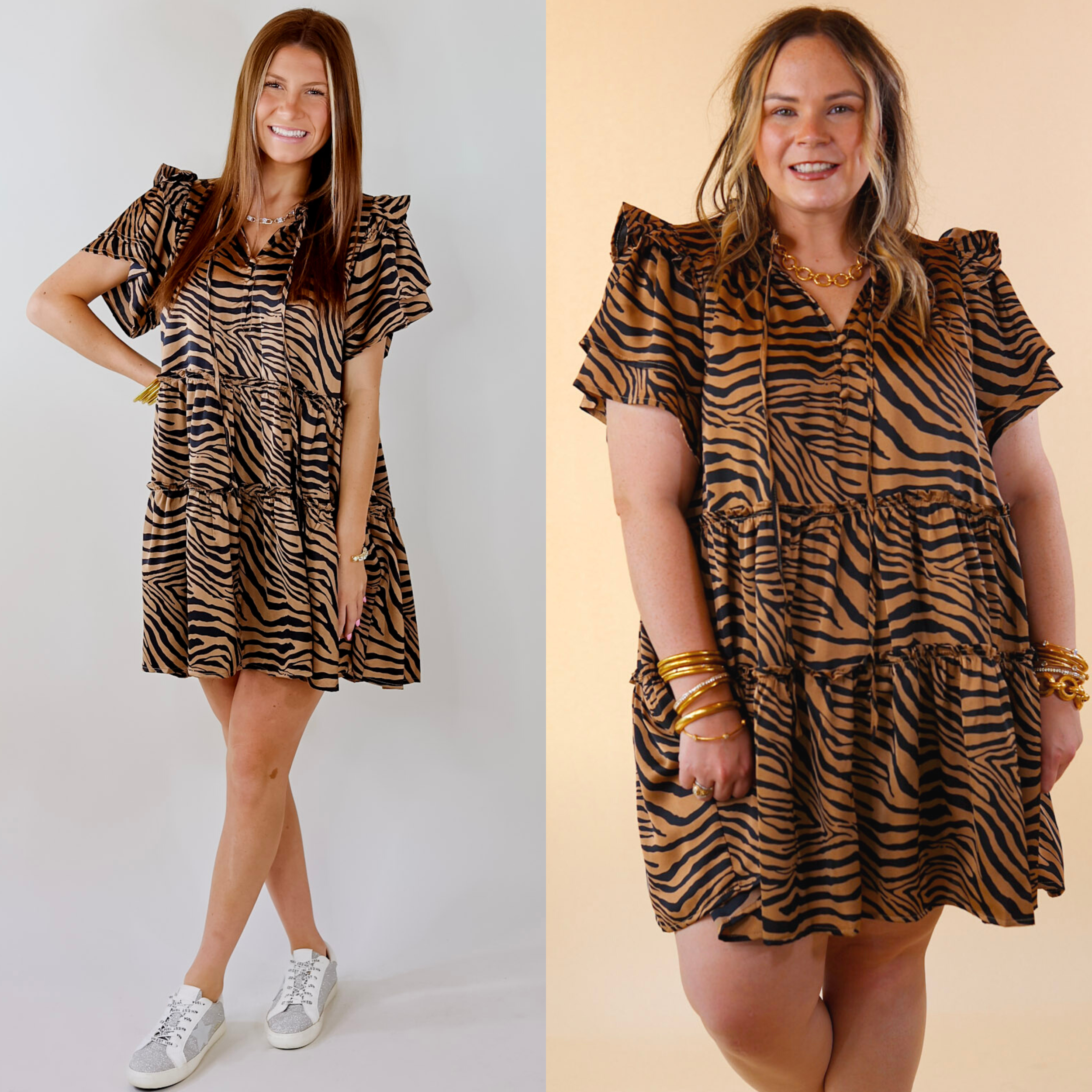 Model is wearing a thigh length mocha brown dress with black zebra print. Model has paired the dress with silver and white sneakers and gold jewelry.