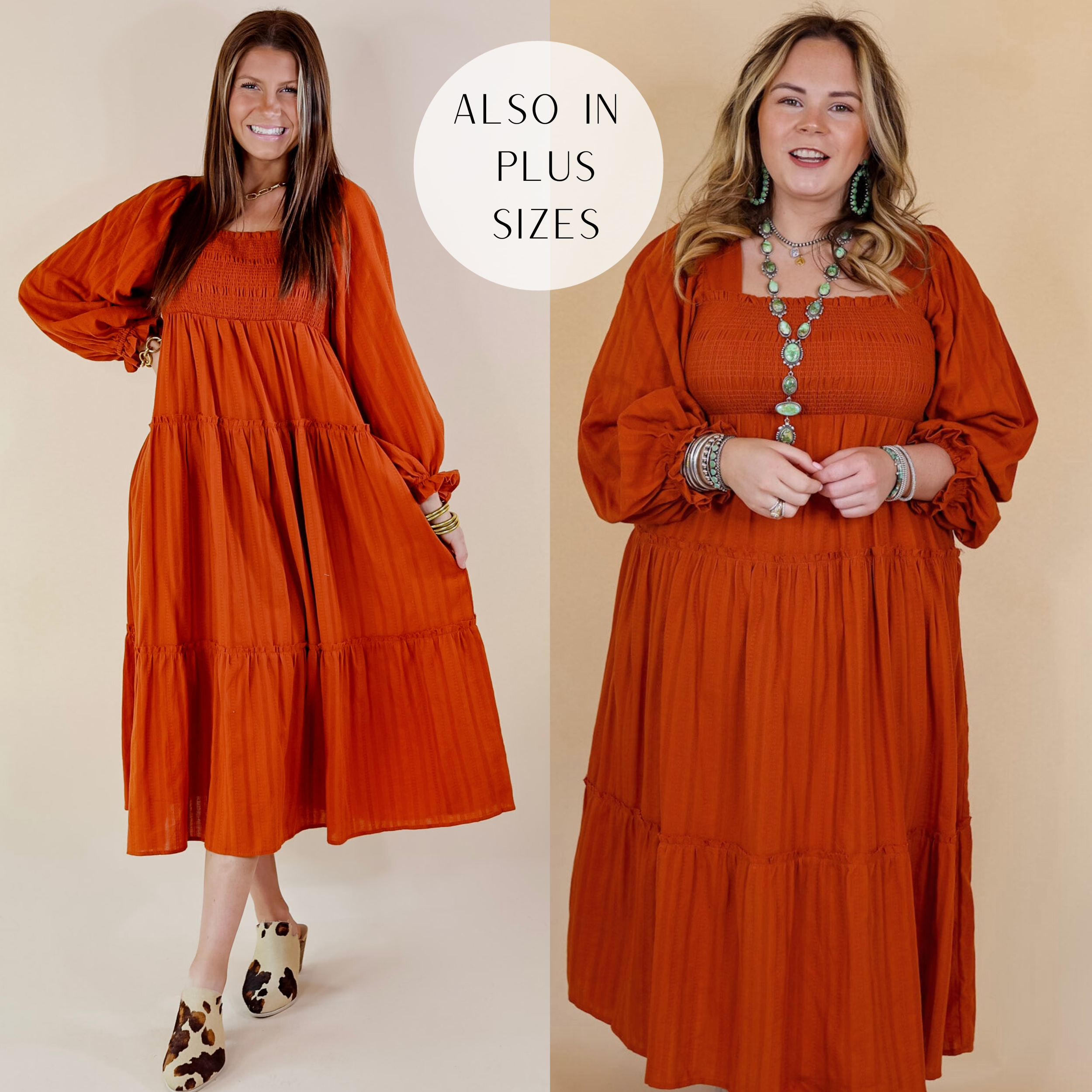 Model is wearing a long sleeve, tiered, dress with a square neckline in rust orange. Model has this dress paired with boots and turquoise jewelry. Background is solid tan.