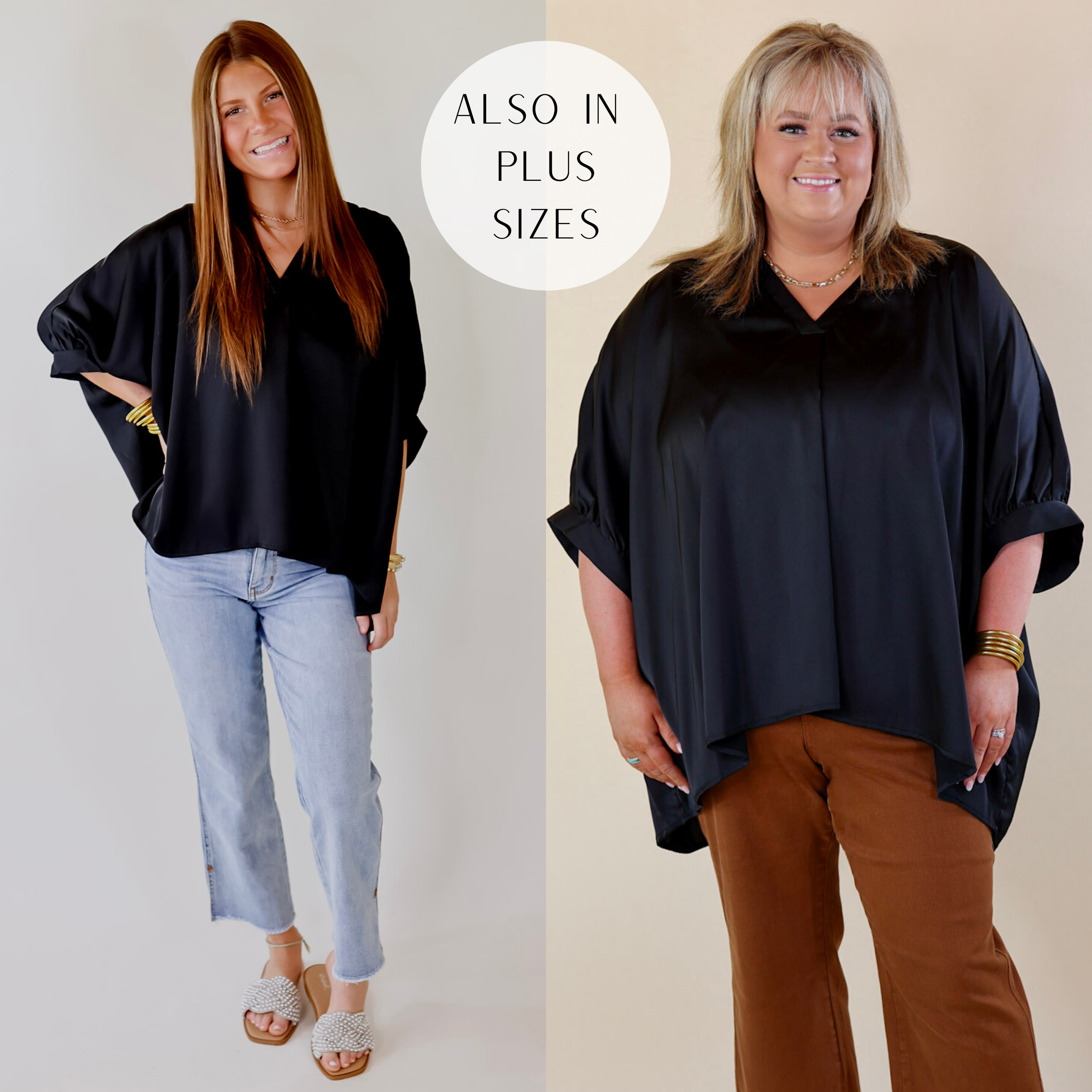 A flowy oversized black blouse featuring a silky fabric, a V neckline, and cuffed sleeves.