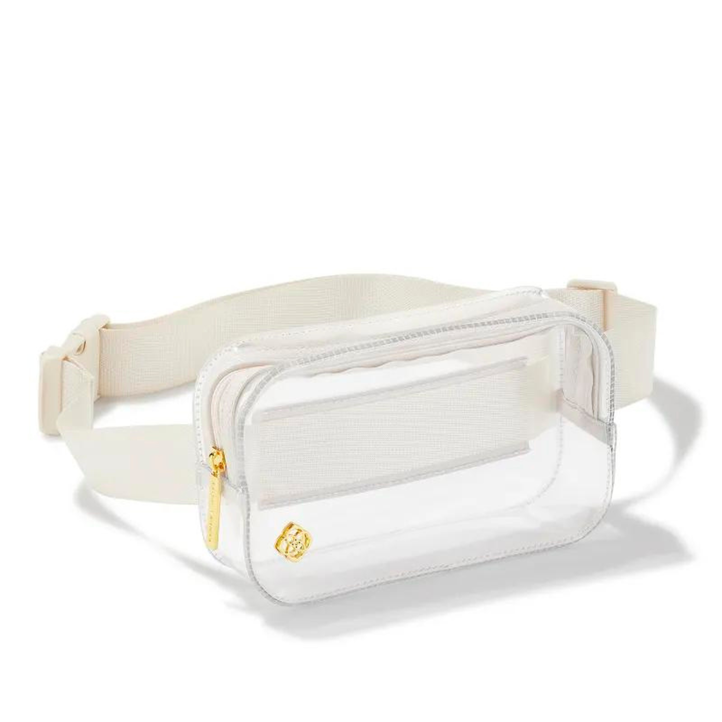 A clear fanny pack with an ivory strap and gold tone Kendra Scott emblem on the front corner pictured on a white background.