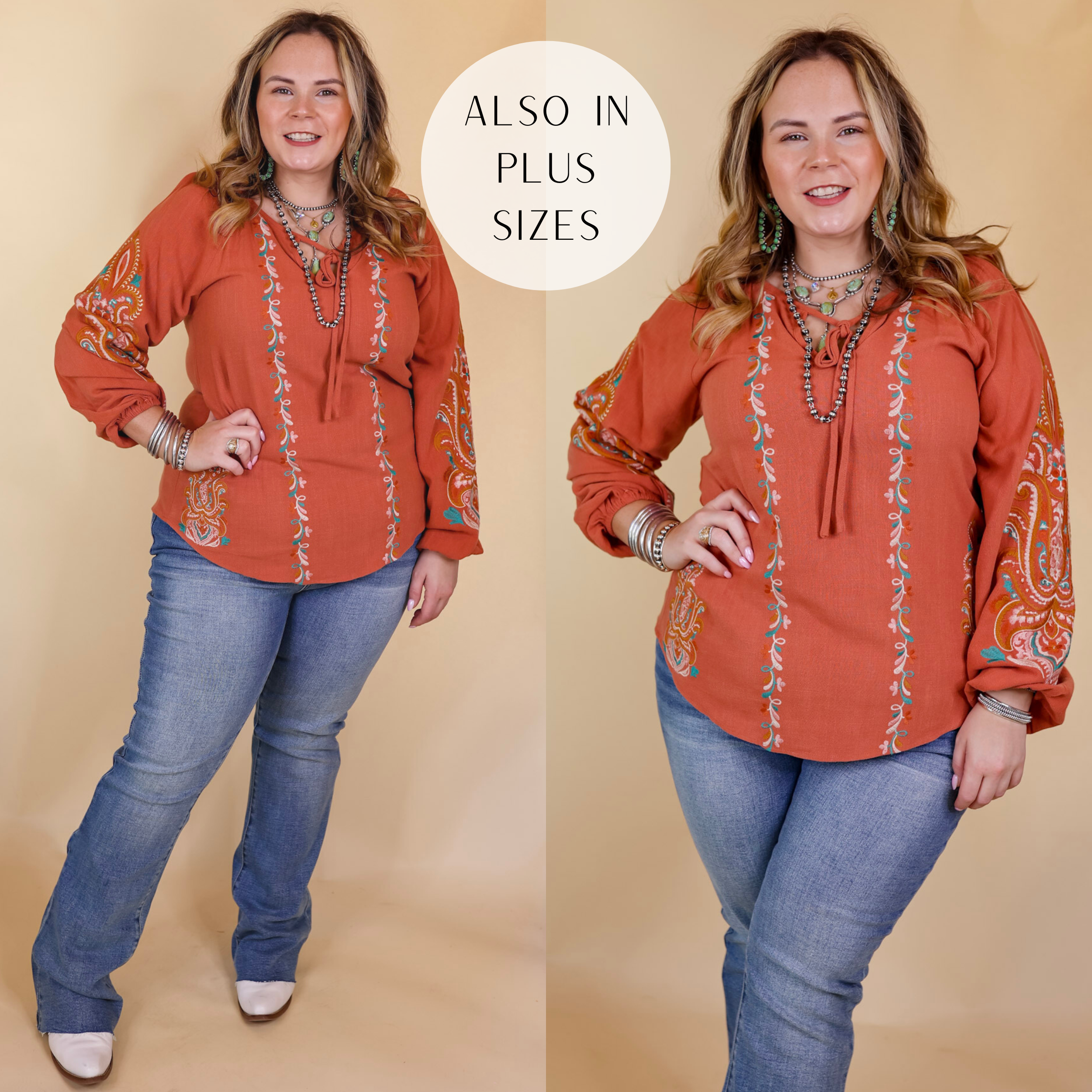 Model is wearing a long sleeve top with embroidery and a front keyhole in clay orange. Model has this top paired with jeans, boots, and Navajo jewelry. Background is solid tan. 