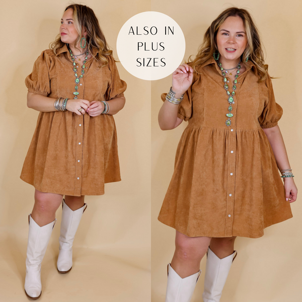 Model is wearing a corduroy babydoll dress in camel brown. Model has this dress paired with tall white boots and Navajo jewelry. Background is solid tan. 