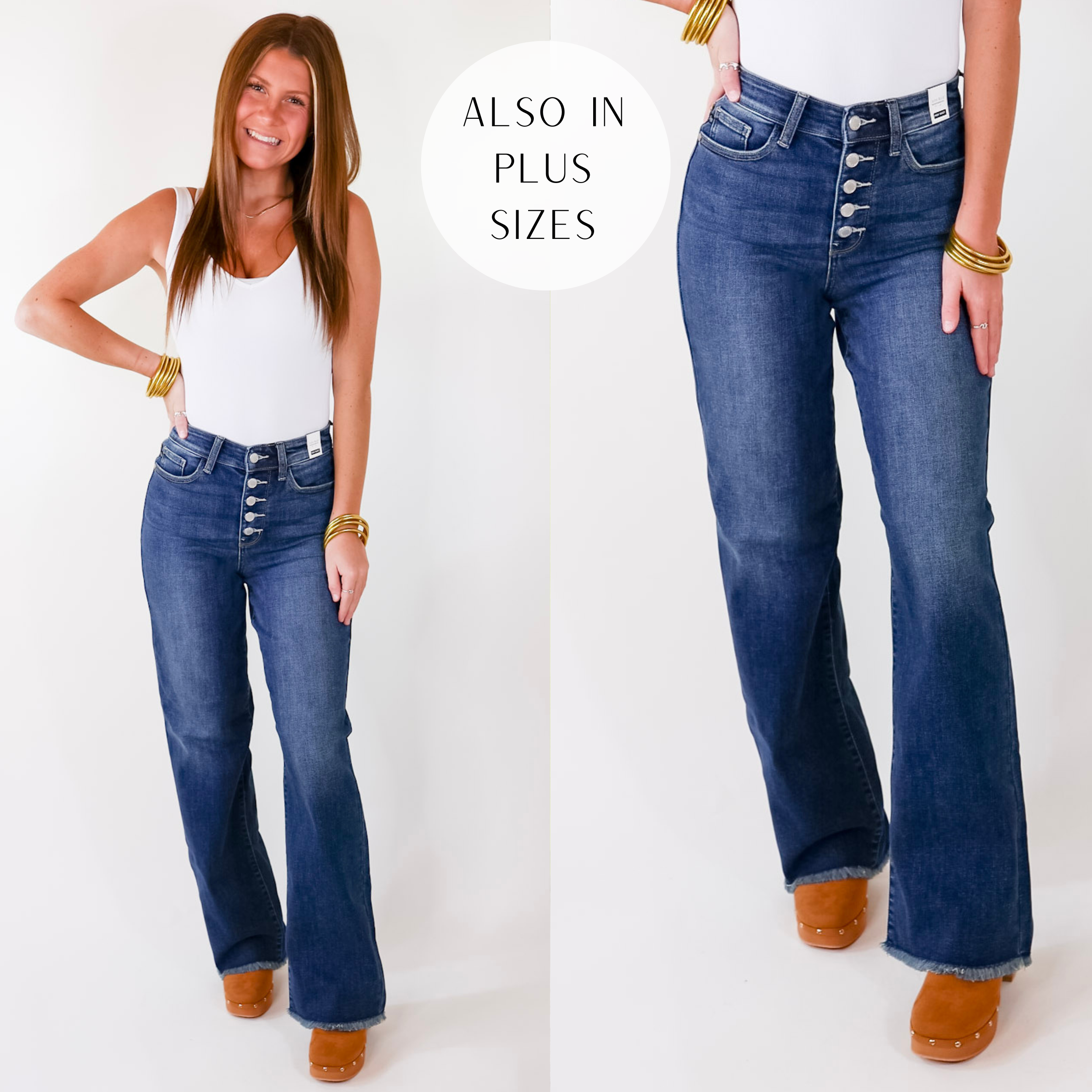 Model is wearing a pair of dark wash wide leg jeans with a button fly. Model has these jeans paired with a white tank top, gold jewelry, and tan slip on shoes.