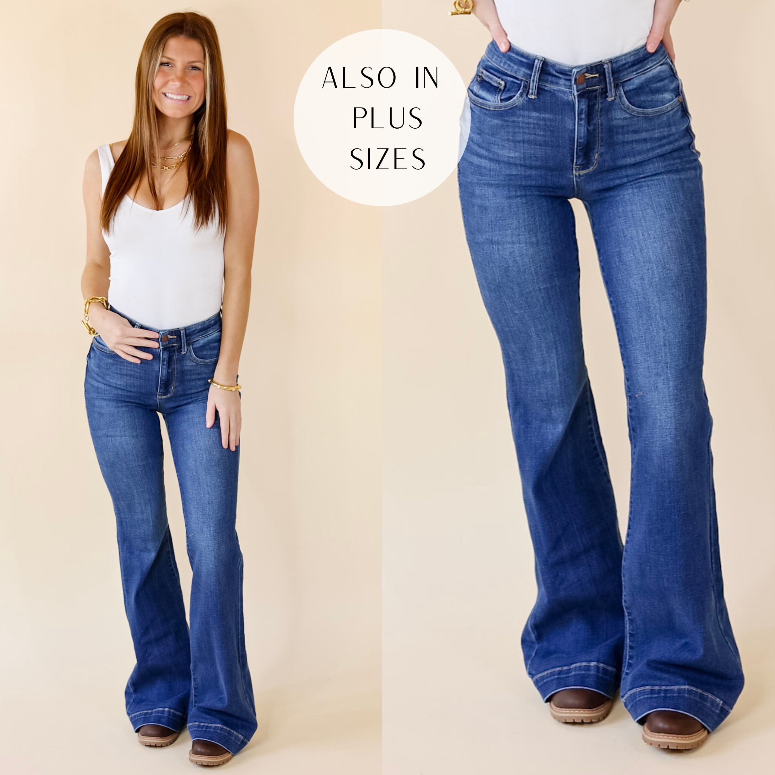 Model is wearing a pair of wide leg jeans with a wide hem. Model has it paired with a white tank top, gold jewelry, and brown booties.