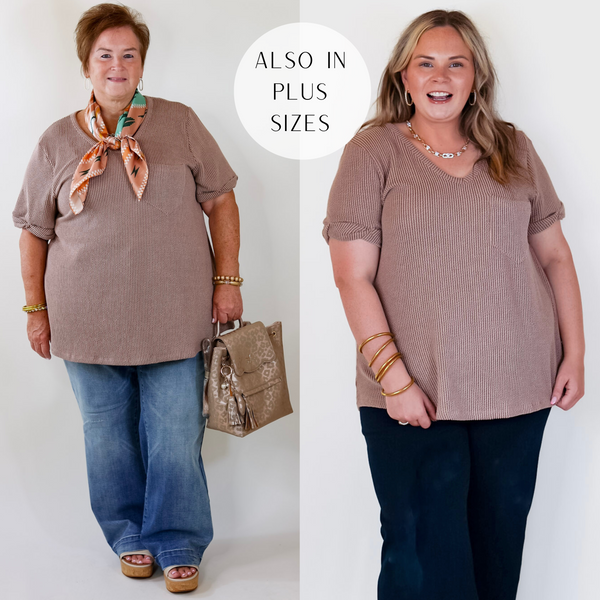Models are wearing a brown ribbed top with short sleeves and a v neckline. Plus size model has this top paired with trouser jeans, a leopard print bag, and gold jewelry.