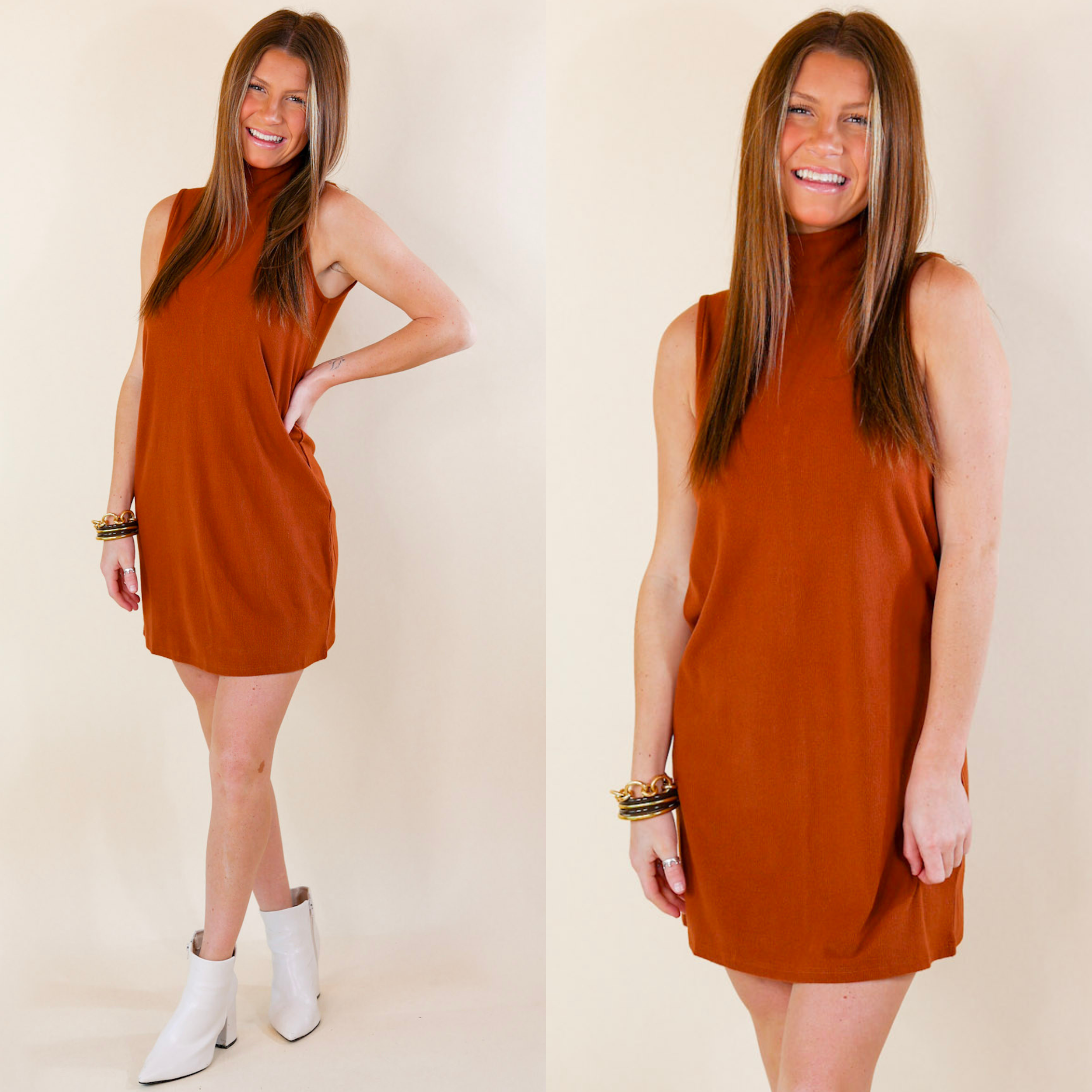 Model is wearing a rust orange tank dress with a mock neck. Model has this sweater dress paired with white booties and gold jewelry.