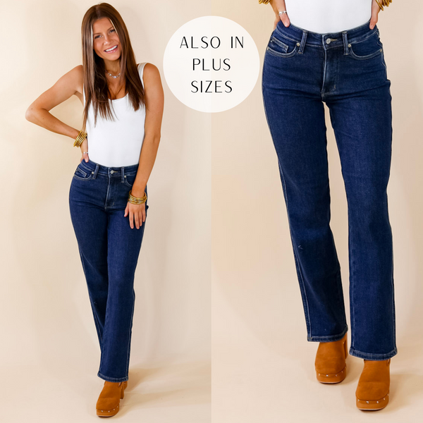 Model is wearing a pair of dark wash straight leg jeans. Model has these jeans paired with a white bodysuit, gold jewelry, and tan clogs.