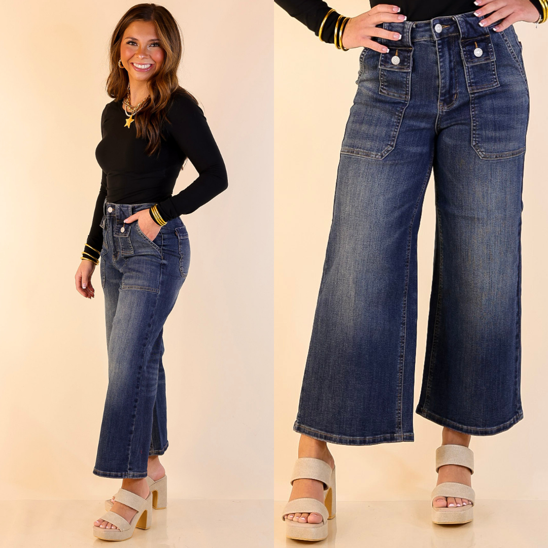 Woman wearing Cropped Wide Leg Utility with Front Patch Pocket Jean in Dark Wash with a plain background