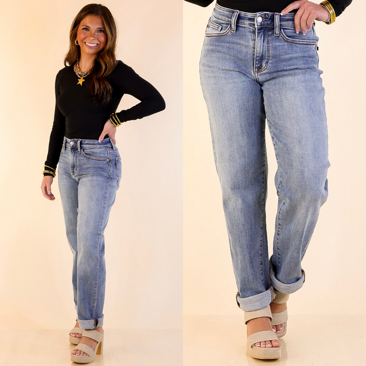 Woman wearing Boyfriend Denim Jeans in Medium Wash with a plain background