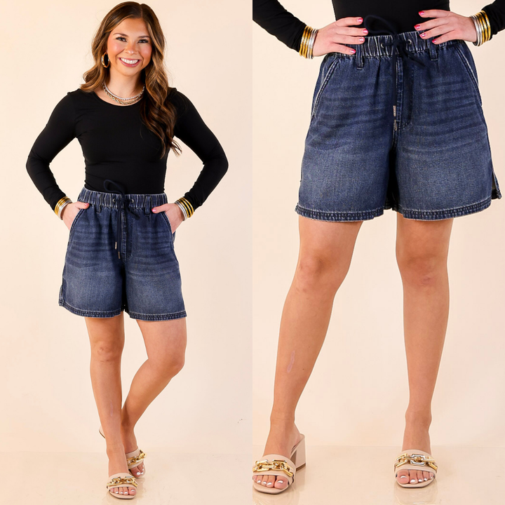 Model is wearing Featherweight Drawstring Denim Shorts in Dark Wash on a beige background
