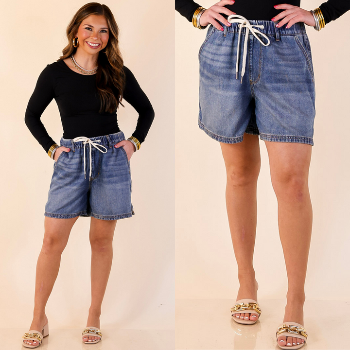 Model is wearing Featherweight Drawstring Denim Shorts in Medium Wash with a plain background