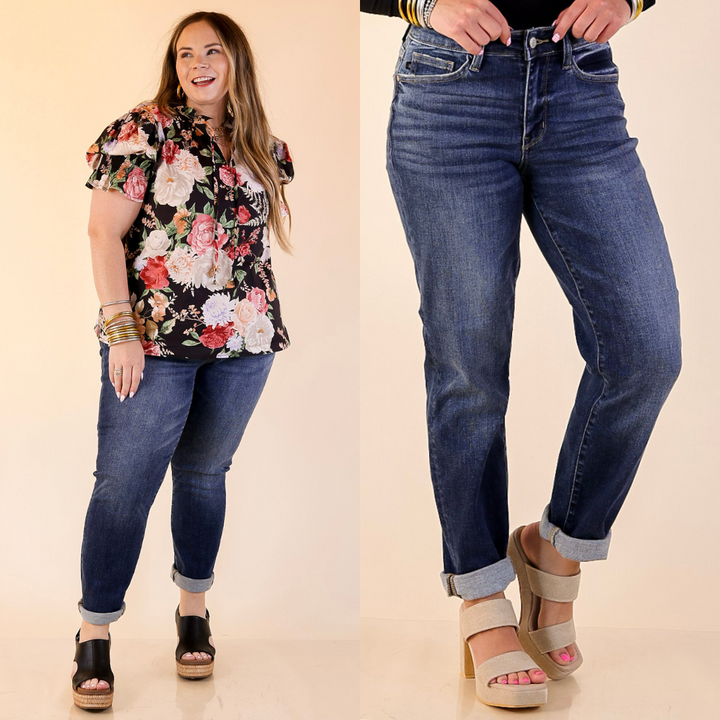 Women wearing cuffed boyfriend denim jeans in dark wash. 