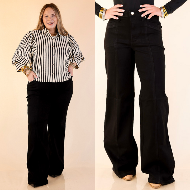 Model is wearing Retro Wide Leg Jean in Black on a beige background