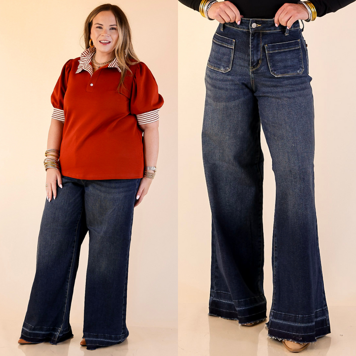 Models wearing wide leg palazzo jeans with raw heh and front patches in dark wash.