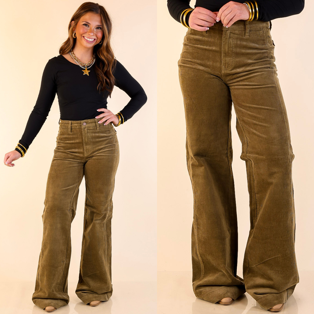 Woman wearing Wide Leg Corduroy Trouser Jeans in Olive Green with a plain background
