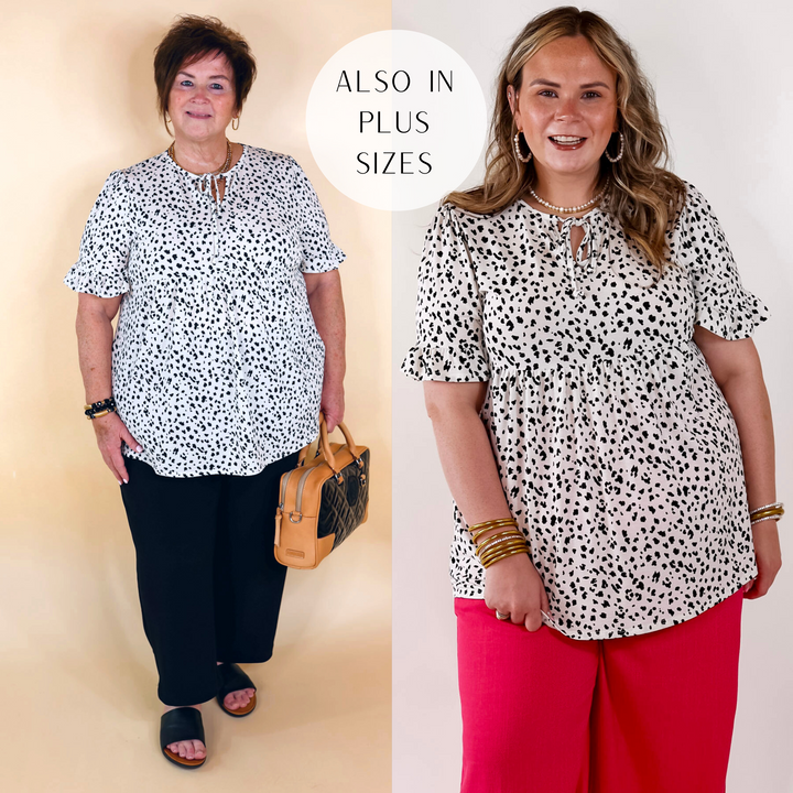 Models are wearing an ivory babydoll top with a black leopard print, keyhole and tie neckline, and short sleeves.