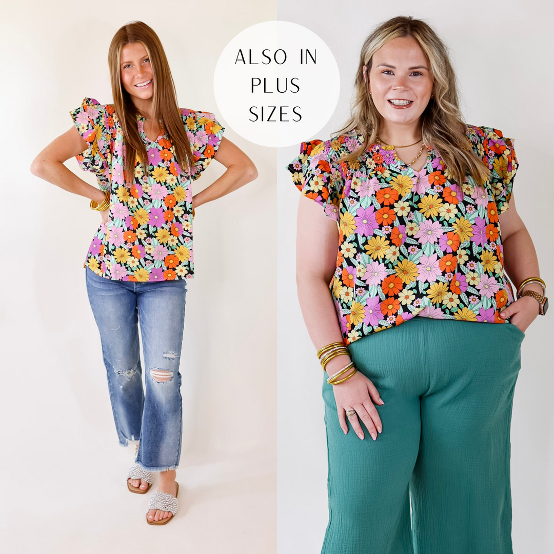 Model is wearing a black top with multi color flowers.