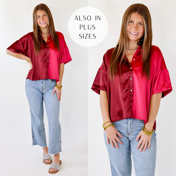 Model is wearing a half maroon and half fuchsia pink button up satin top with a collared neckline.