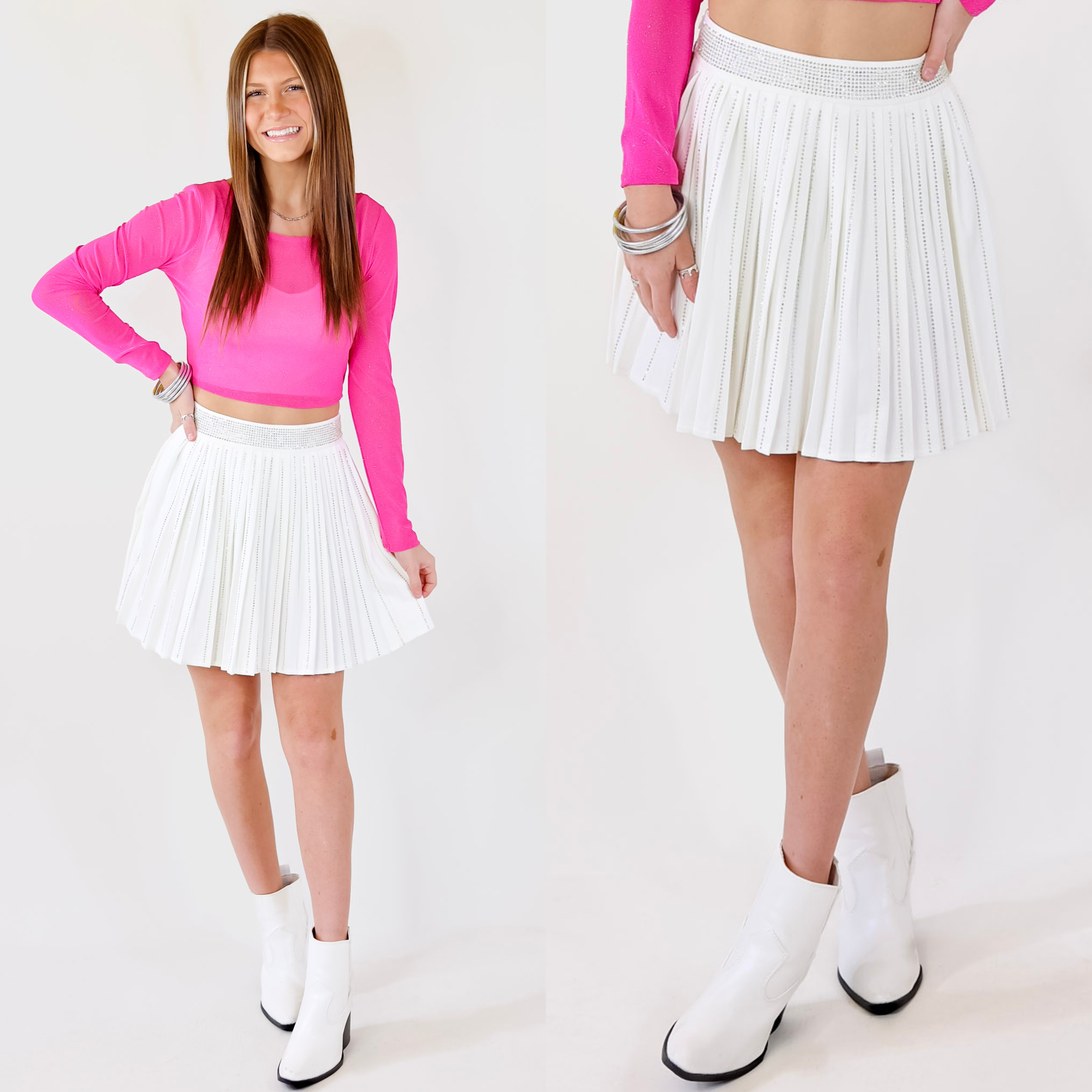 Model is wearing a white skirt featuring rhinestones on the waistband, pleated skirt, and rhinestones on the skirt.