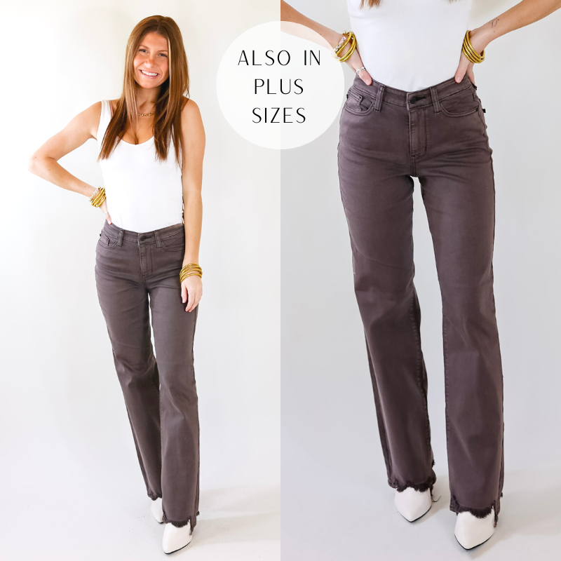 Model is wearing a pair of dark brown straight leg jeans with a distressed hem. Model has these jeans paired with white booties, a white bodysuit, and gold jewelry.
