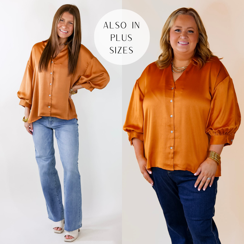 Model is wearing a 3/4 balloon sleeve button up top in pumpkin orange. Model has paired the top with straight cut jeans, white heels, and gold tone jewelry.