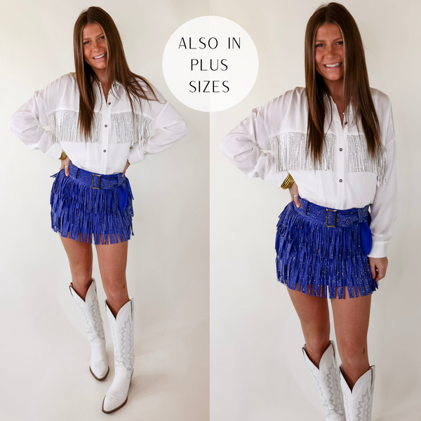 Model is wearing a royal blue skort with crystal fringe throughout and a crystal belt