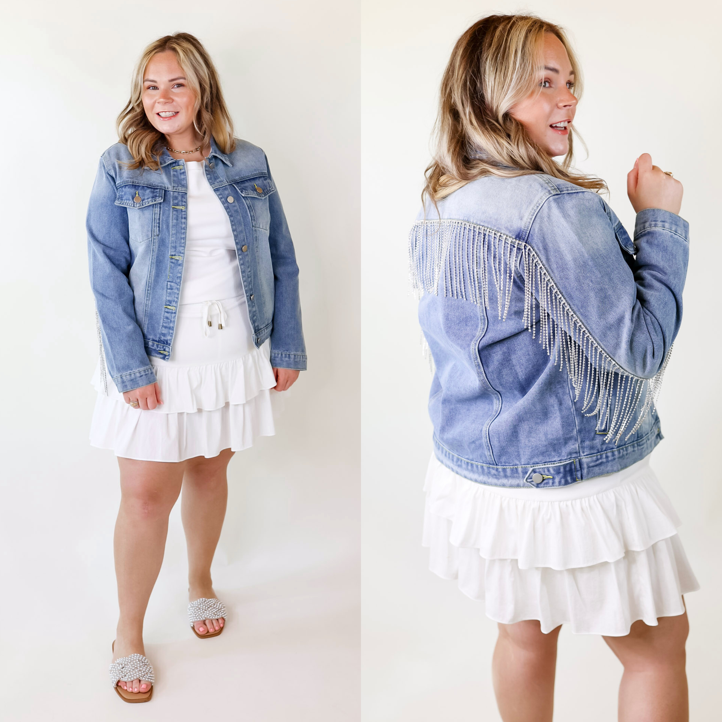 Model is wearing a medium wash button up denim jacket featuring two front pockets, a collar, and crystal fringe lining the upper back and arm.