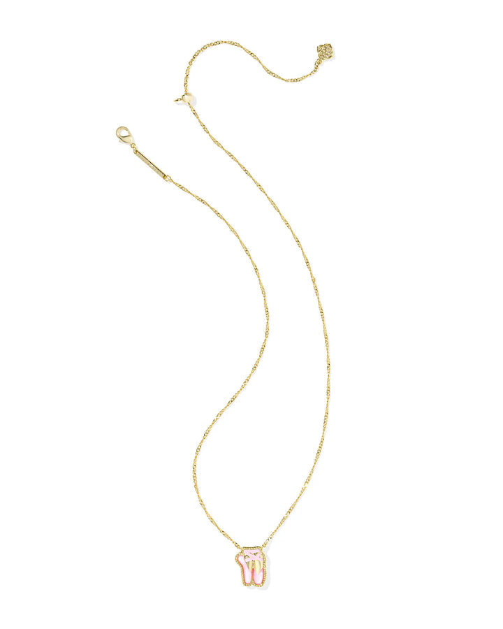Gold necklace with a small ballet pendant in blush mother of pearl on a white background.