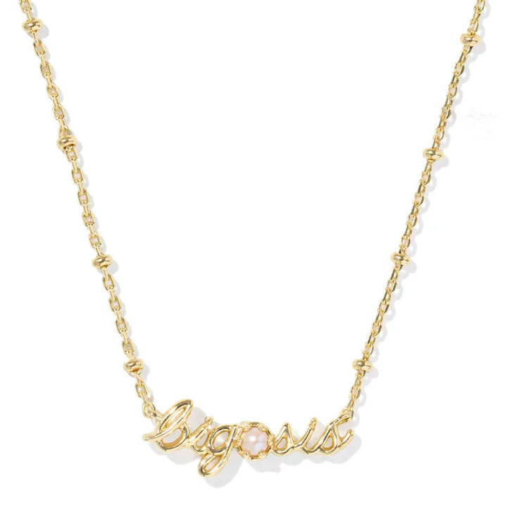 Gold necklace with 'Big sis' pendant on a white background