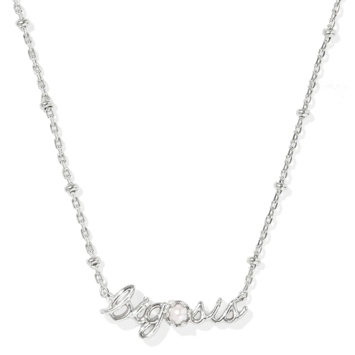 Silver necklace with 'big sis' pendant on a white background