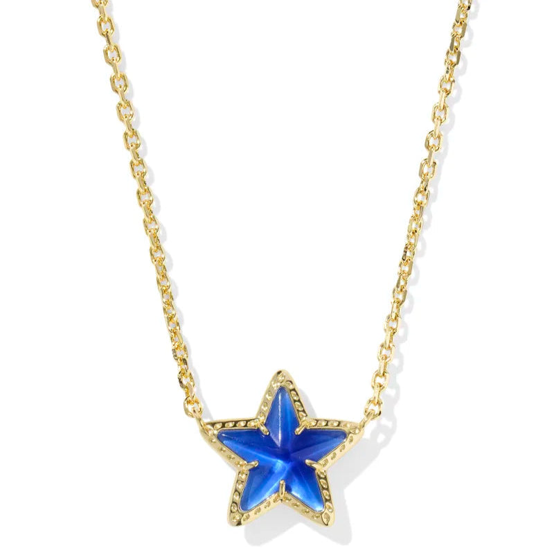 A solid white background with a gold chain necklace that has a star shaped pendant in cobalt blue