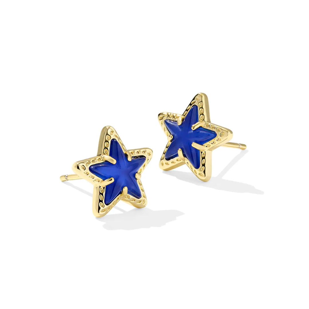 Solid white background with gold star shaped stud earrings in cobalt blue 