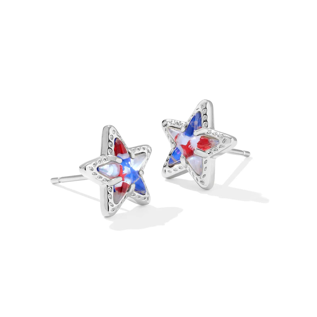 A solid white background with star shaped stud earrings in silver and Red White Blue Star Illusion