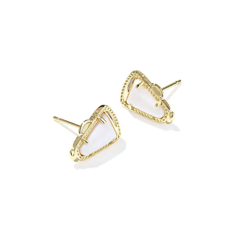 Gold-trimmed white megaphone earrings on a white background