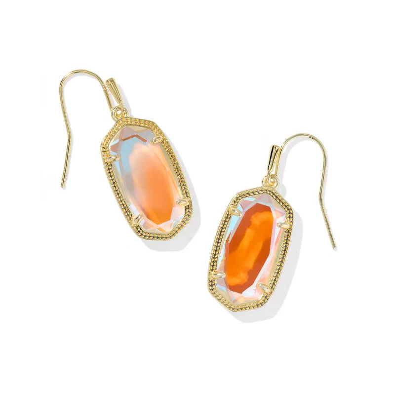 Gold earrings with dichroic glass stone on a white background