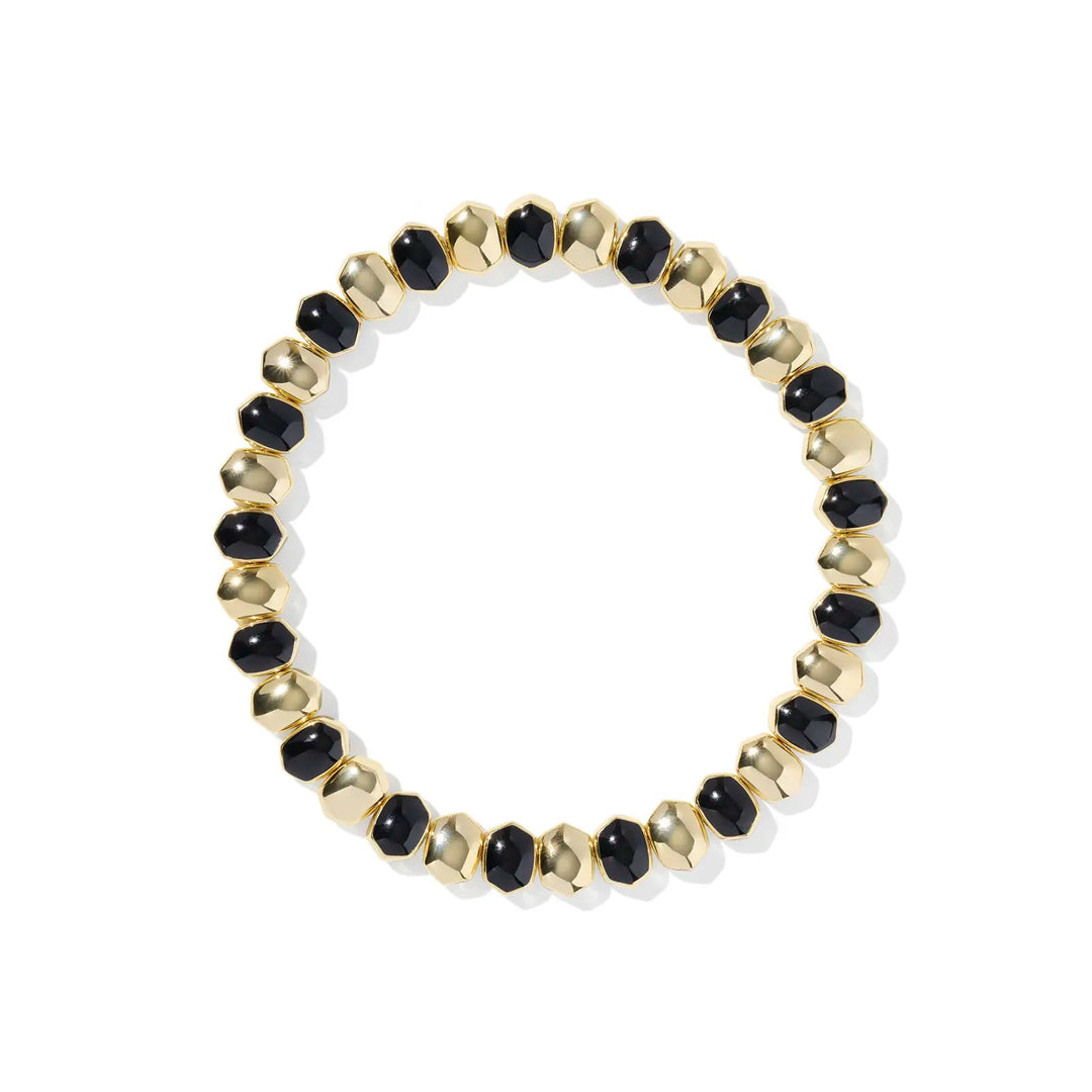 Beaded bracelet with black and gold beads on a white background