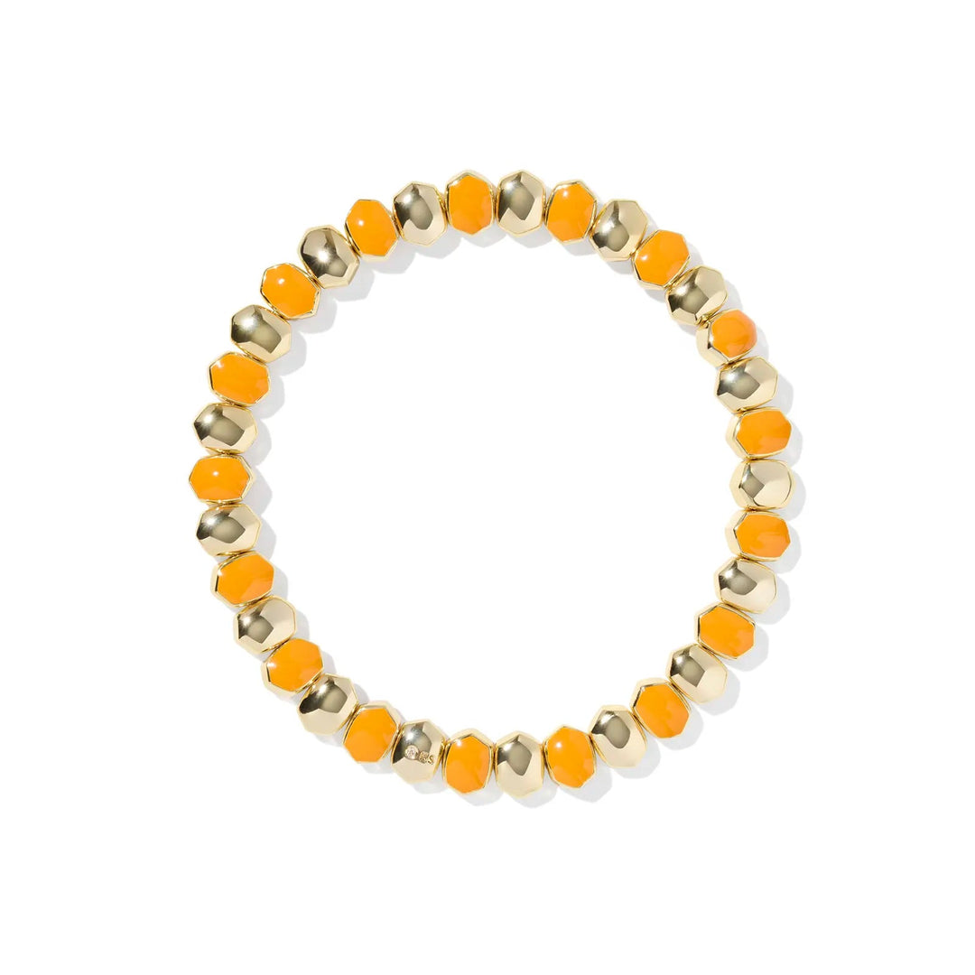 Bracelet with orange and gold beads on a white background.