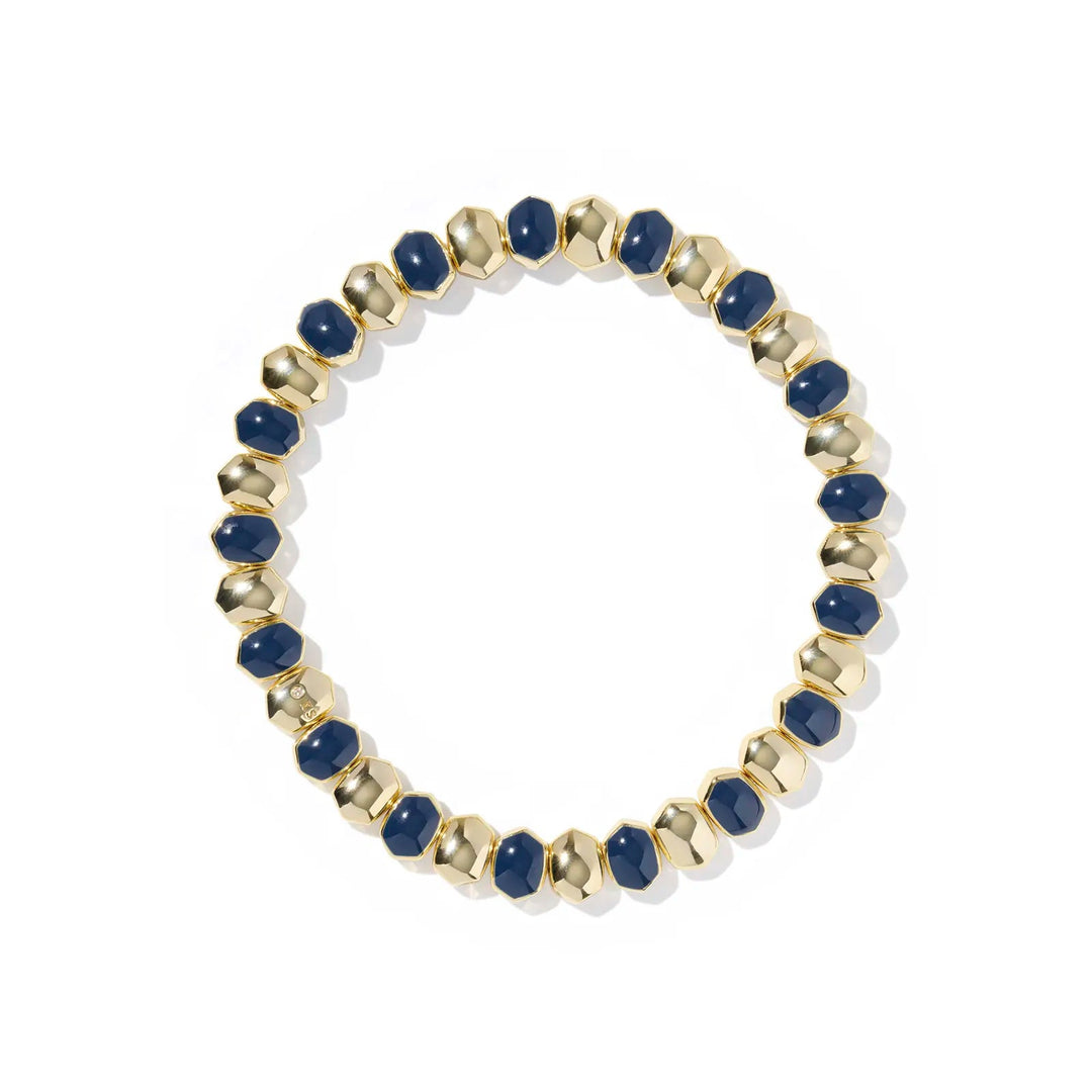 Bracelet with navy blue beads and gold accents on a white background