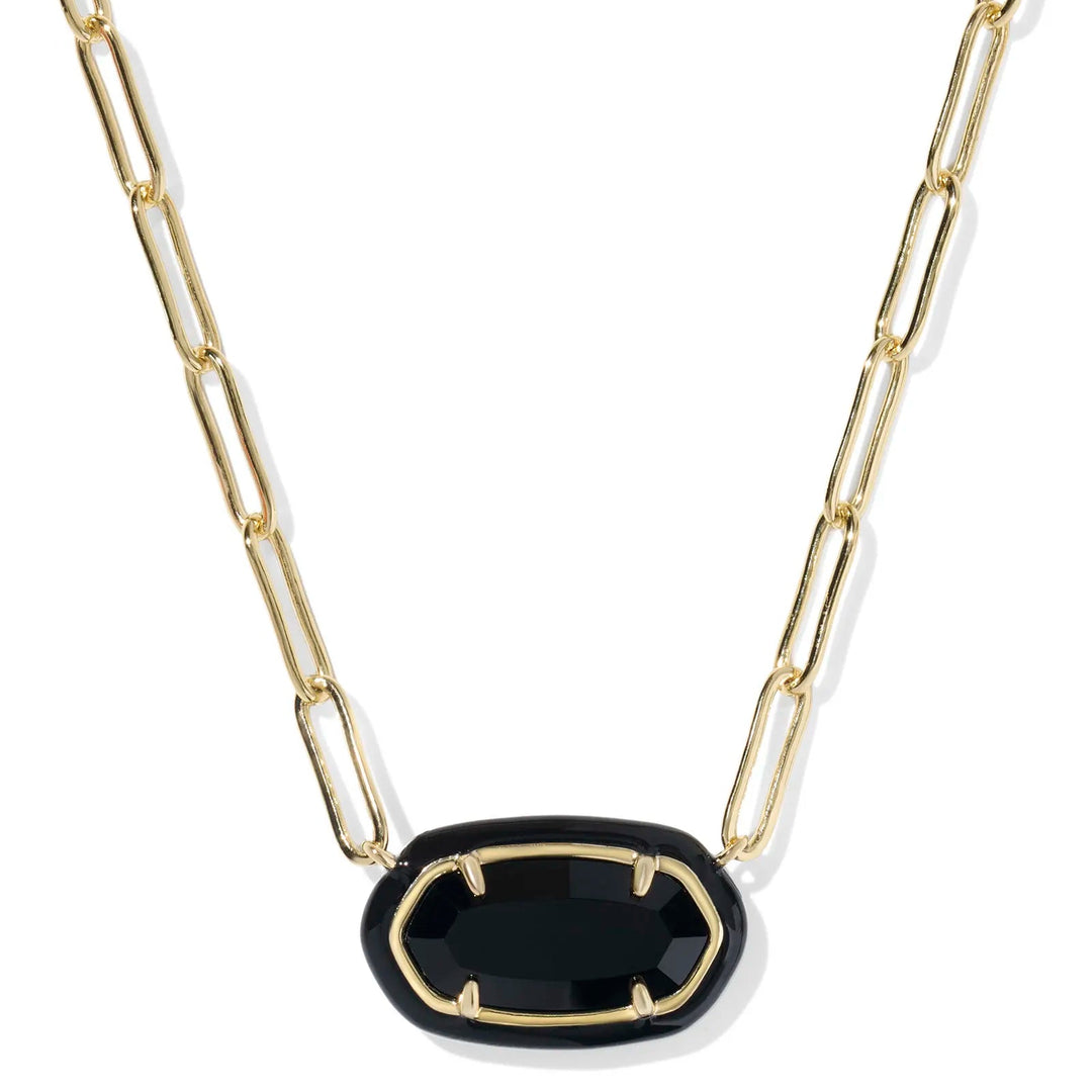 Gold chain necklace with a black pendant on a white background