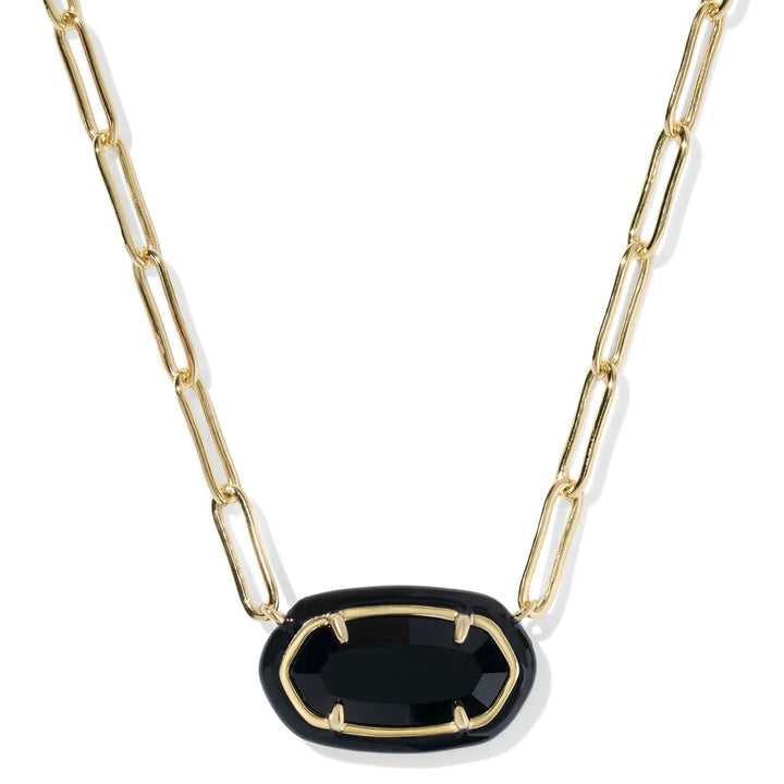 Gold chain necklace with a black pendant on a white background