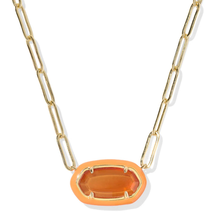 Gold necklace with a large orange stone pendant on a white background