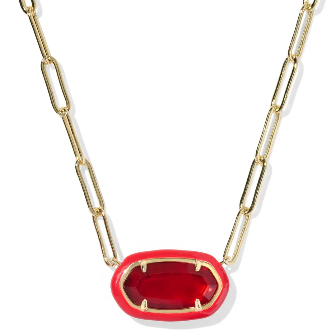 Gold chain necklace with a red pendant on a white background