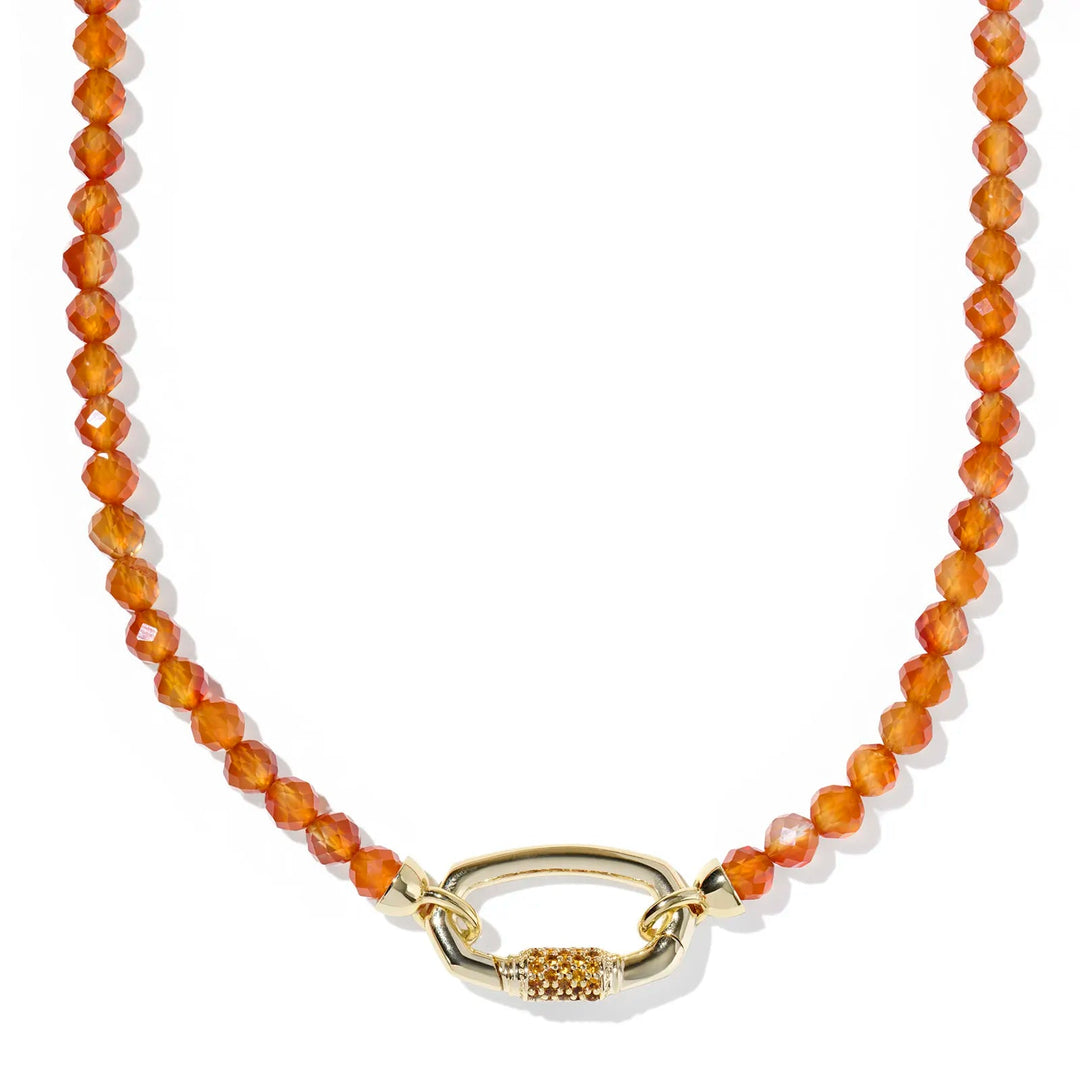 Necklace with orange beads and a gold clasp on a white background