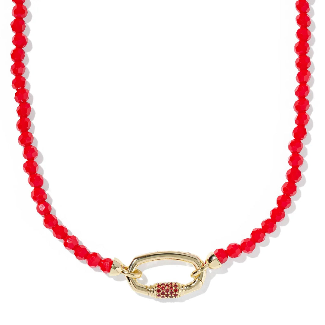 Necklace with red beads and a gold clasp on a white background