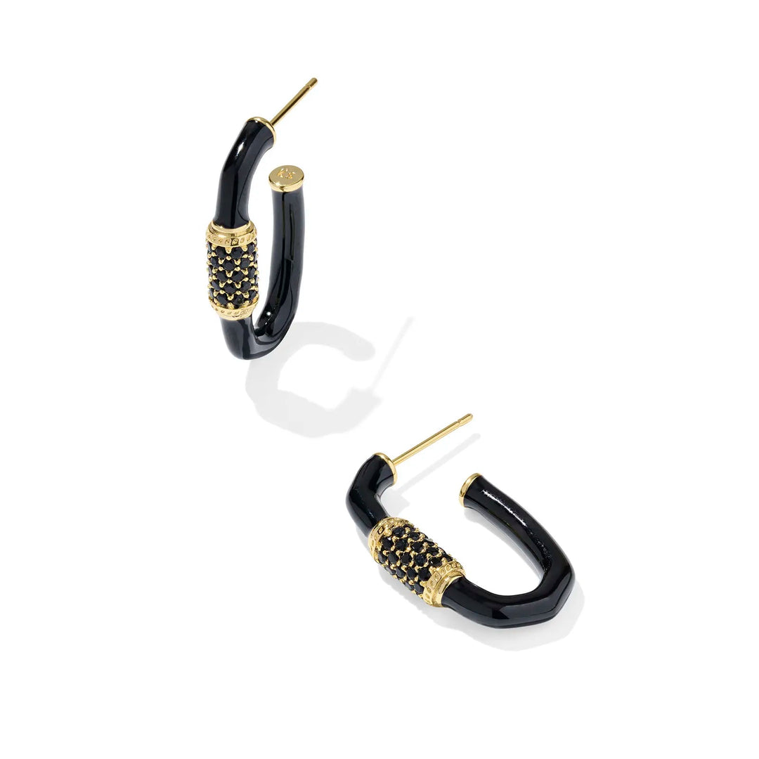 Black and gold hoop earrings on a white background