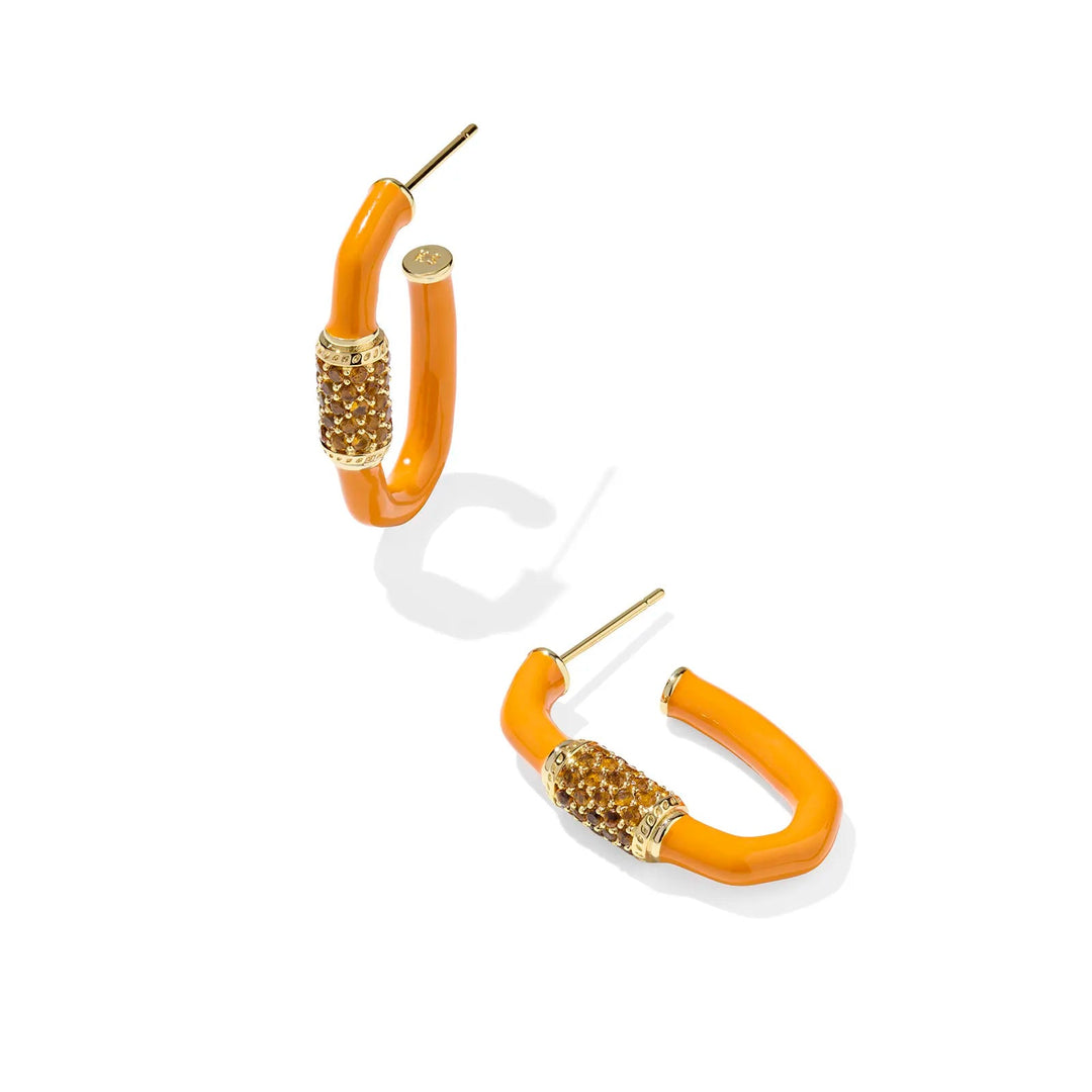 Pair of orange hoop earrings with gold accents on a white background