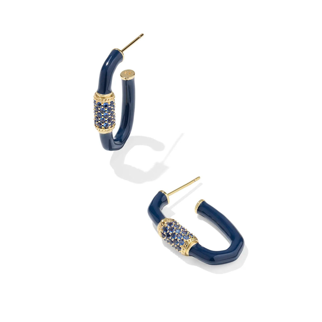 Navy hoop earrings with gold accents on a white background